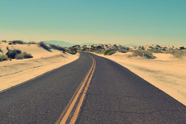 Abstract architectural dark glass reflecting subtle warm light, premium tech concept, no human figures, no woman image